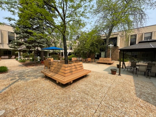 Outdoor area with seating and trees
