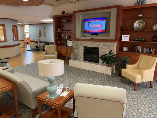 Interior view of a common area with seating and TV