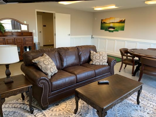 Inviting living room with brown sofa, coffee table, and decorative elements
