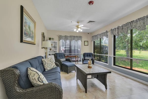 Bright common area with seating and large windows