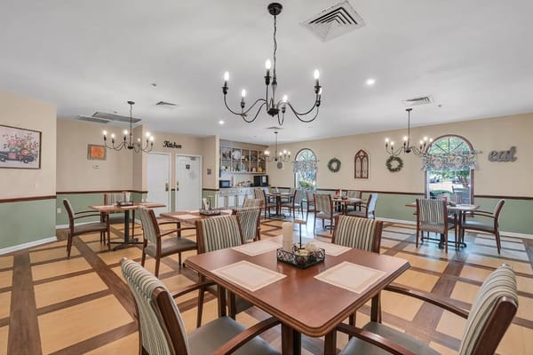 Dining area with tables and chairs in a warm setting