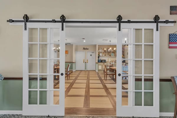 Interior dining area with sliding doors and decor