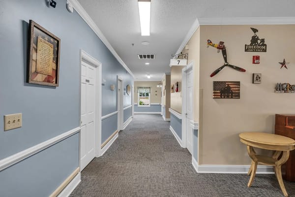 Well-lit hallway in a senior living facility