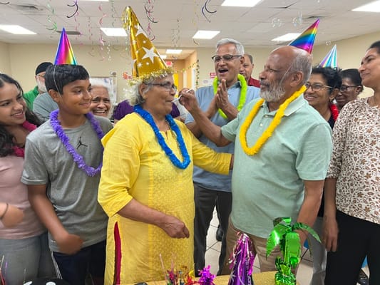Seniors and family members celebrating together at a party.