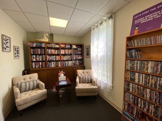 Cozy reading nook with bookshelves and seating