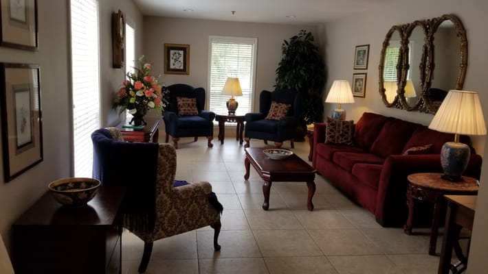 Comfortable living area with seating and decorative flowers