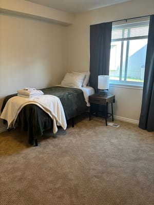 Cozy private bedroom with bed and window light