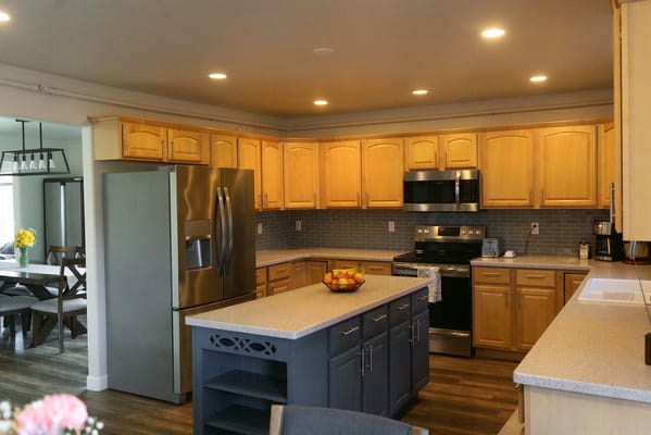 Modern kitchen with wooden cabinets and appliances