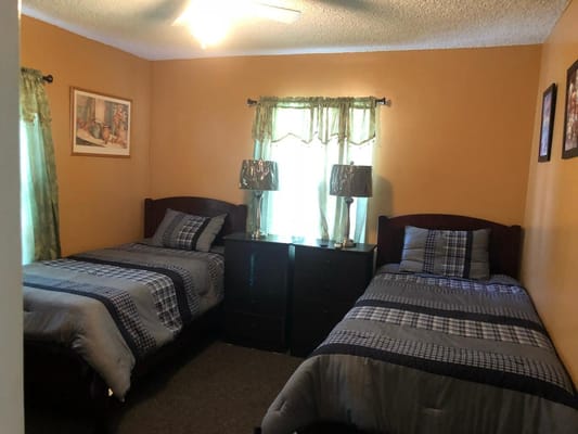 Cozy shared resident room with two beds.