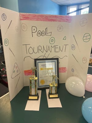 Trophies and certificate for a pool tournament