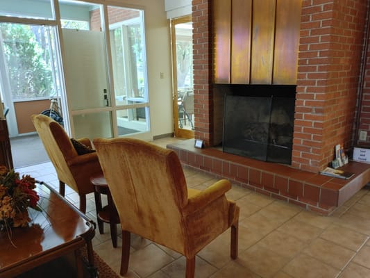 Comfortable chairs in front of a fireplace