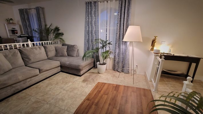 Cozy waiting area with a comfortable couch and decor