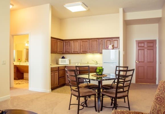 Cozy kitchen and dining area in a senior living apartment