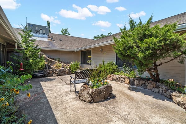 Outdoor garden space with seating and landscaping