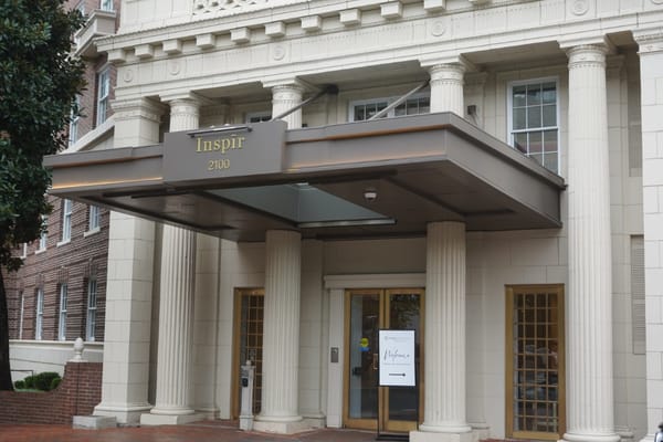 Front entrance of Inspīr Embassy Row with columns
