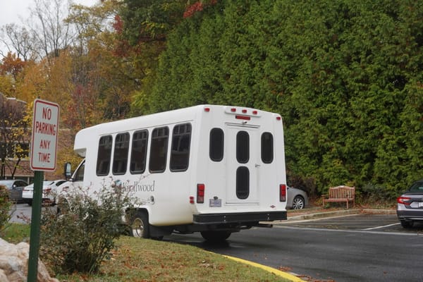 Facility transport shuttle parked in the lot