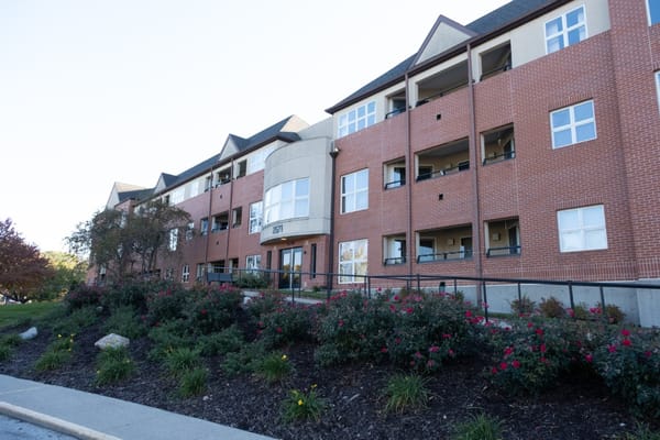 Front view of Valley View Village building with landscaped garden