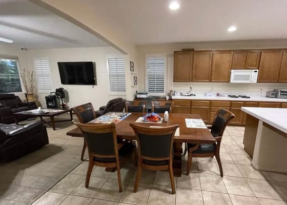 Cozy dining area with a table and chairs in a senior living facility