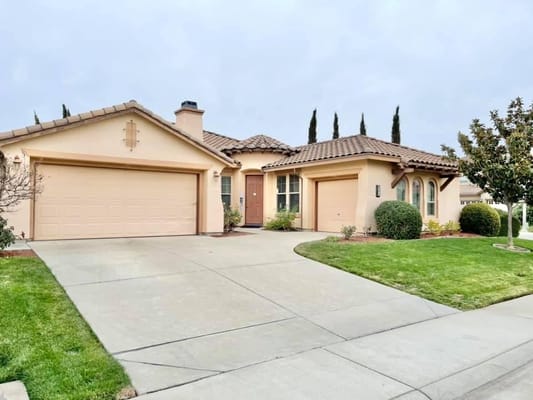 Front view of A Loving Senior Care Home with landscaped yard