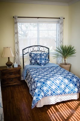 Cozy bedroom with blue and white bedspread