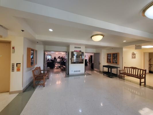 Interior view of a common area with seating and activity space