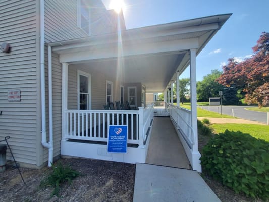 Exterior view of a covered porch at a senior care facility
