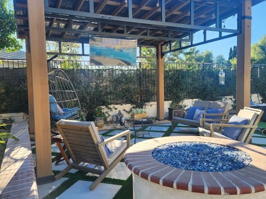 Outdoor seating area with a fire pit and chairs