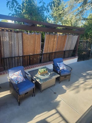 Outdoor seating area with chairs and table