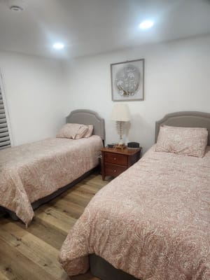 Two twin beds in a cozy resident room