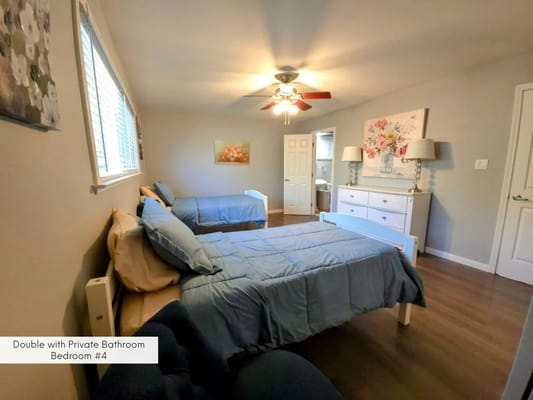 Private bedroom with two beds and a bathroom