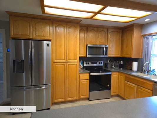 Spacious kitchen area with modern appliances
