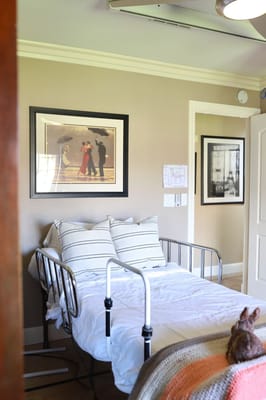 A cozy resident room with framed artwork