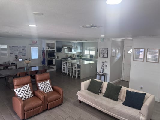 Interior common area with seating and kitchen space