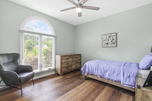 Cozy resident room with a bed and seating