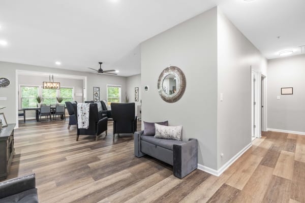 Bright common area with seating and dining space