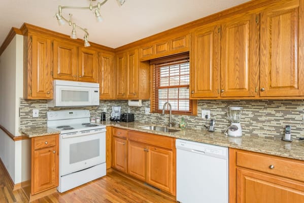Bright kitchen with wooden cabinets and modern appliances