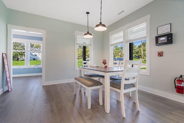 Bright interior room with dining table and chairs
