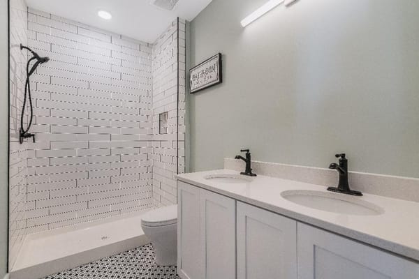 Modern bathroom interior with shower and sinks