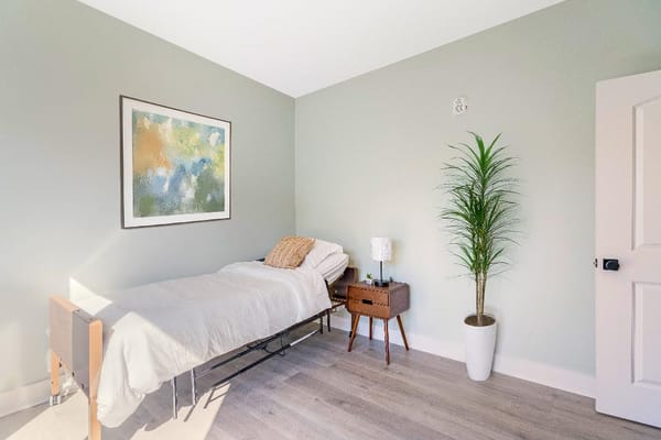 Private resident room with bed and decor