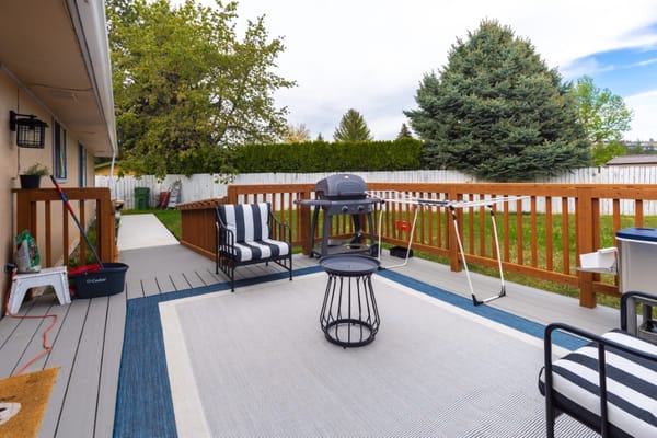 Outdoor patio with seating and grill