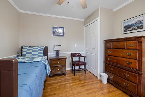 Cozy private resident room with bed and dresser