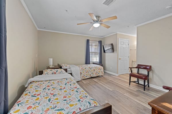 Interior view of a shared resident room with beds