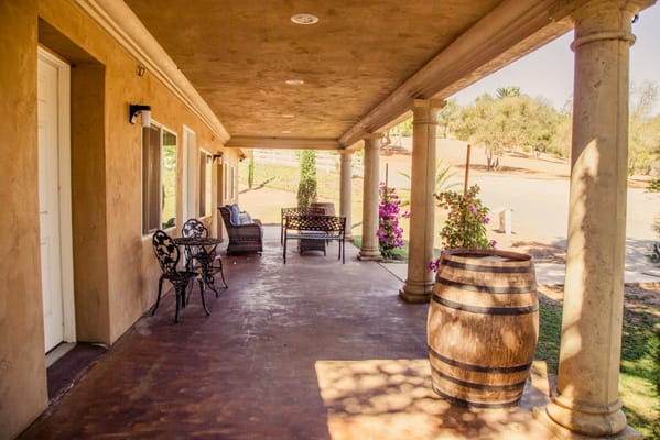 Covered outdoor seating area with flowers
