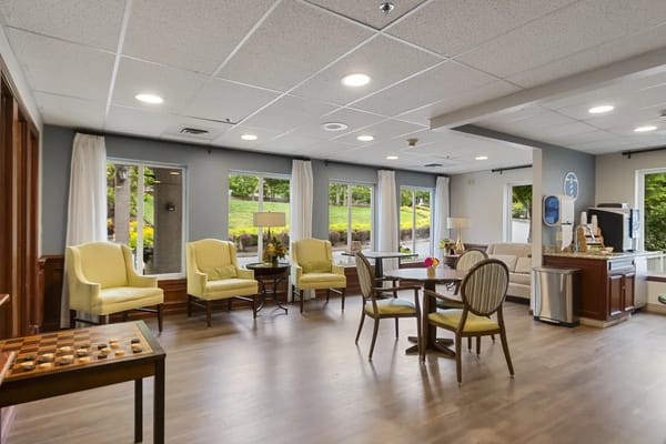 Cozy lounge with seating and a coffee station