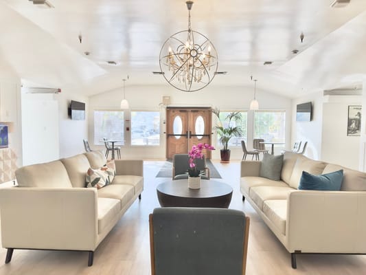 Spacious living room with comfortable seating and natural light