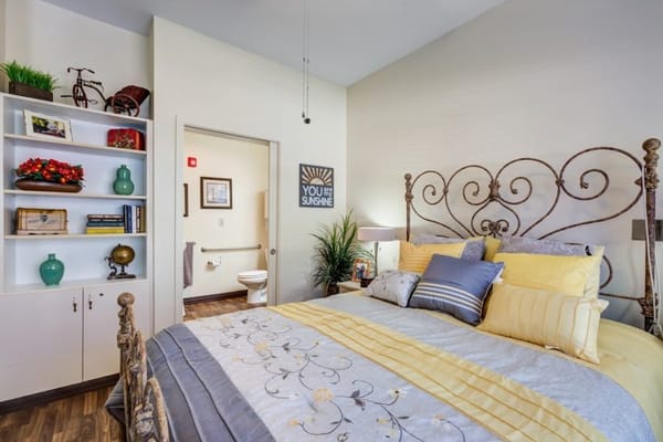 Cozy resident room with floral bedding and decor
