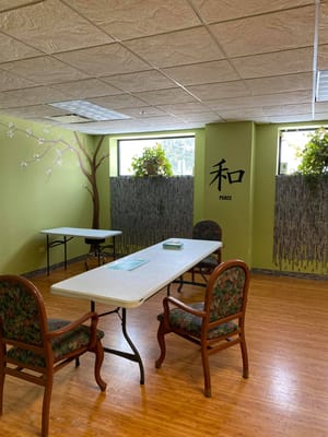 Interior view of a common area with tables and plants