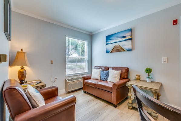 Cozy lounge area with seating and decorative elements