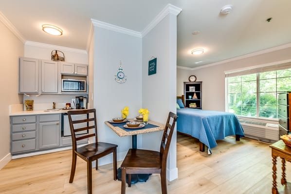 Cozy interior view of a resident room with kitchen area
