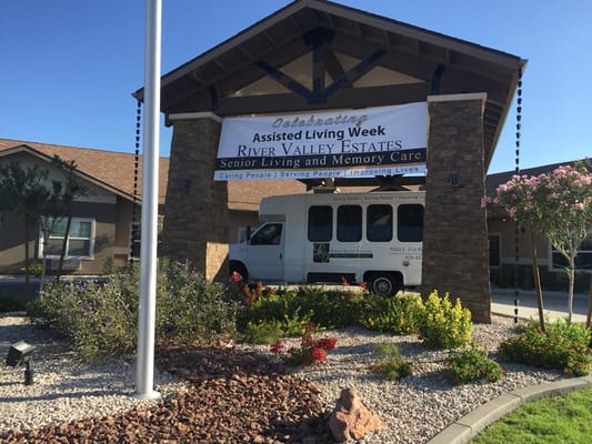 Exterior view of River Valley Estates with a celebration banner